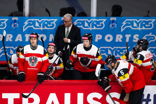 Head coach Roger Bader and Marco Kasper of Austria look