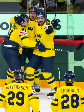 Emil Heineman, Mikael Backlund and Rasmus Andersson of