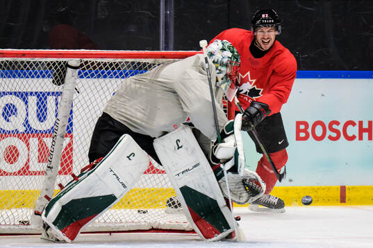 Goaltender Marc-Andre Fleury and Sidney Crosby of Canada at