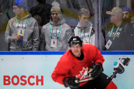 Urban Podrekar of Slovenia watch Sidney Crosby of Canada at