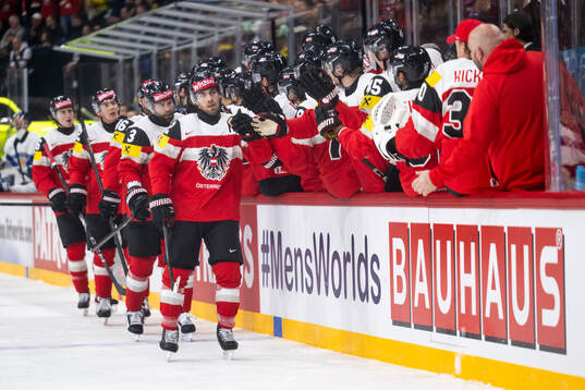 Bernd Wolf of Austria celebrates with team mates