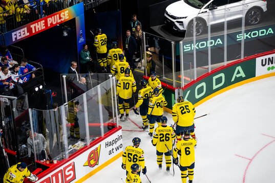 Players of Sweden leave the ice