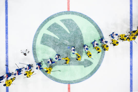 Players of Sweden and of Slovakia shake ands