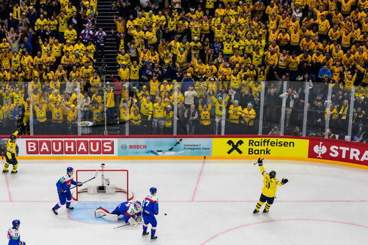Emil Heineman, Mikael Backlund and Rasmus Andersson of