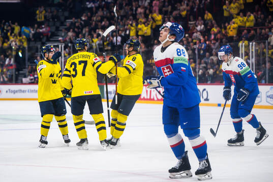 Jonas Brodin and Isac Lundeström of Sweden celebrates