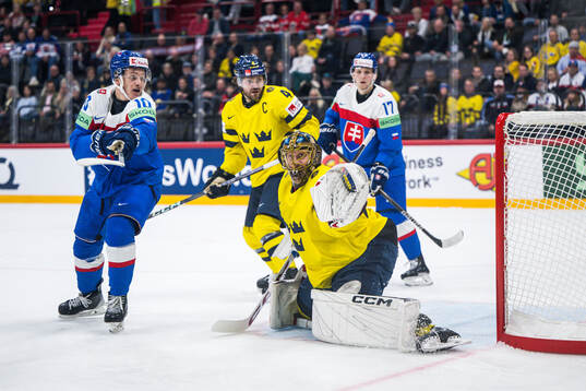 Goaltender Jacob Markström and Rasmus Andersson of Sweden