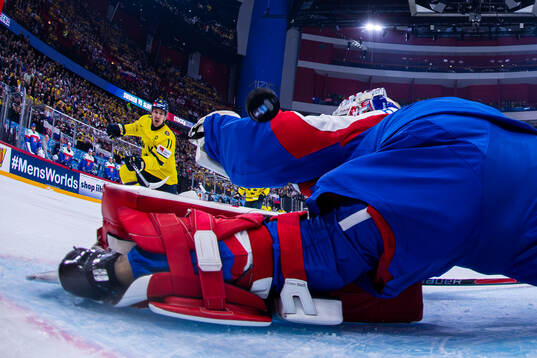 Mikael Backlund of Sweden scores the 1-0 goal