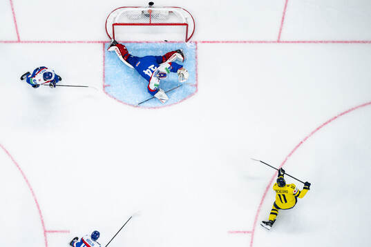 Mikael Backlund of Sweden scores the 1-0 goal behind
