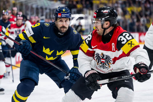 Filip Forsberg of Sweden and Bernd Wolf of Austria