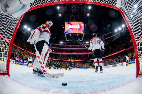 Players of Sweden celebrate and goaltender David Kickert of