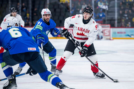 Zan Jezovsek of Slovenia and Kent Johnson of Canada