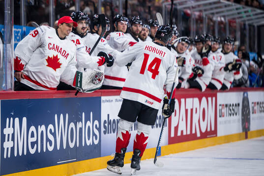 Goaltender Marc-André Fleury and Bo Horvat of Canada