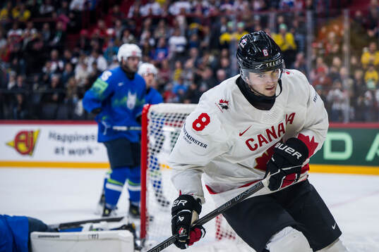 Noah Dobson of Canada celebrates