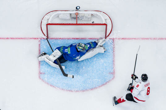 Noah Dobson of Canada scores the 0-4 goal behind goalkeeper