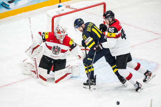 Goaltender David Kickert and Gregor Biber of Austria with