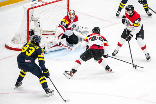 Mika Zibanejad of Sweden and David Kickert of Austria
