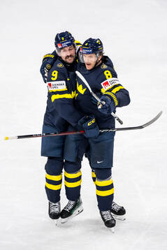 Filip Forsberg and Jonas Brodin of Sweden celebrating