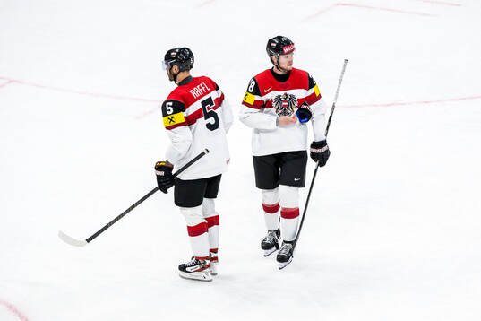 Thomas Raffl and Thimo Nickl of Austria look dejected