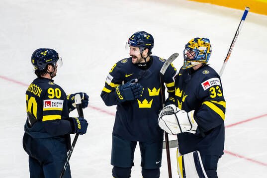 Marcus Johansson, Filip Forsberg, and goaltender Samuel