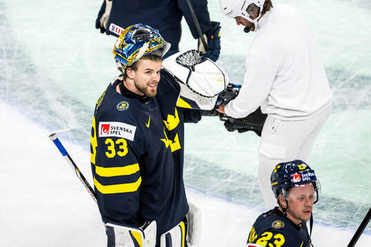 Goaltender Samuel Ersson of Sweden celebrating