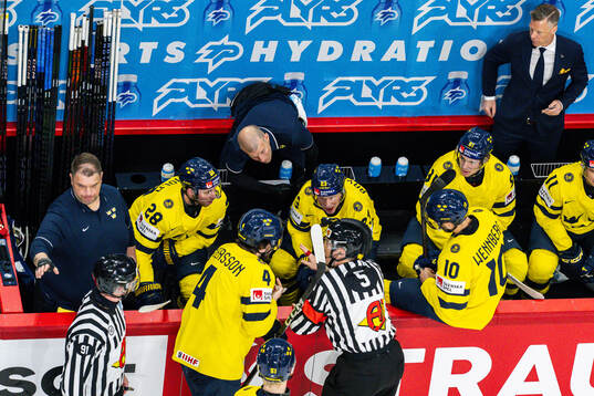 Lucas Raymond of Sweden and referee Andre Schrader