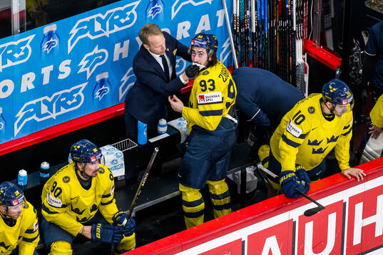 Mika Zibanejad of Sweden receives medical attention