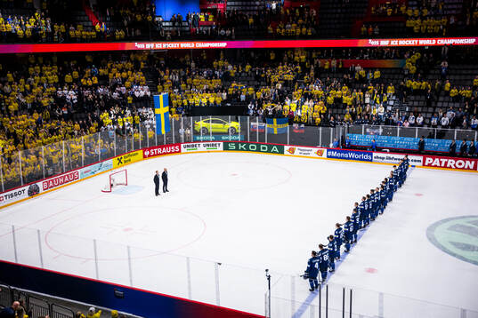 Players of Finland as the Swedish flag is raised