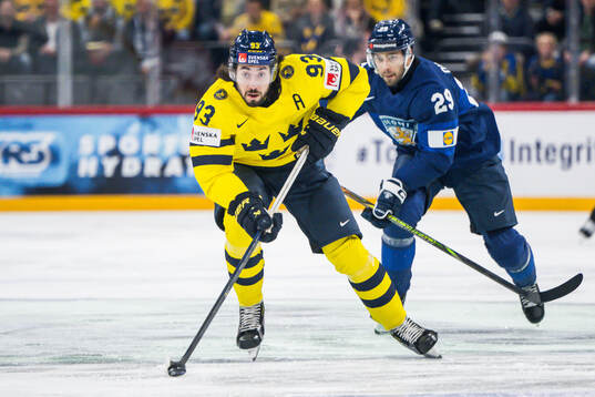 Mika Zibanejad of Sweden and Ahti Oksanen of Finland
