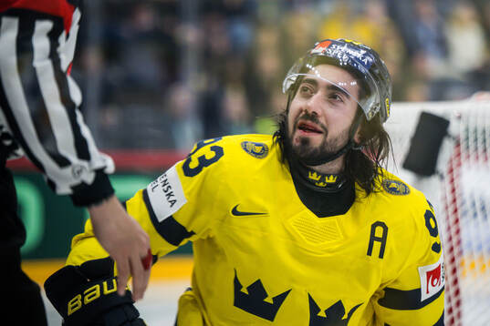 Mika Zibanejad of Sweden bleeding from the mouth