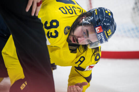 Mika Zibanejad of Sweden bleeding from the mouth