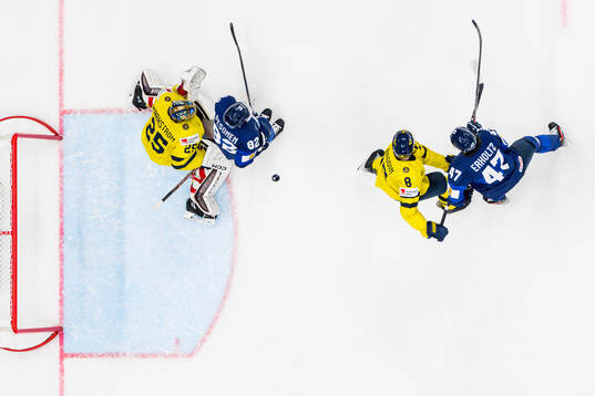 Jonas Brodin and goaltender Jacob Markström of Sweden