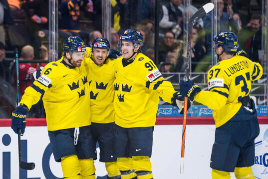 Adam Larsson, Leo Carlsson and Isac Lundeström celebrate