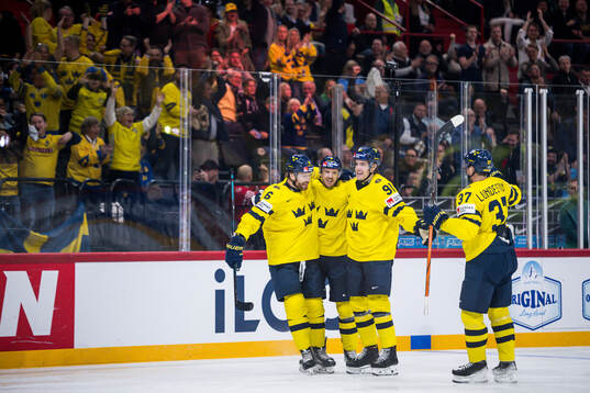 Adam Larsson, Leo Carlsson and Isac Lundeström celebrate