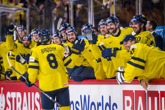 Jonas Brodin of Sweden celebrates with Mika Zibanejad,