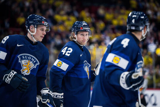 Waltteri Merelä and Robin Salo of Finland look dejected