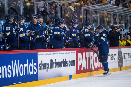 Harri Pesonen of Finland celebrates with team mates