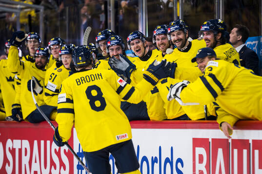 Jonas Brodin of Sweden celebrate with Mikael Backlund,