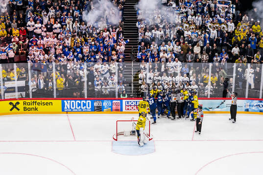 Goaltender Jacob Markström of Sweden watch as players react
