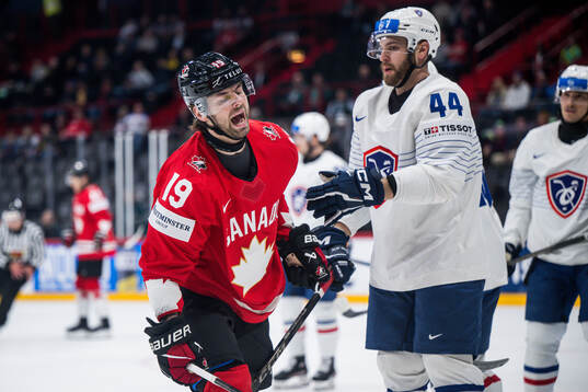 Adam Fantilli of Canada and Kevin Spinozzi of France