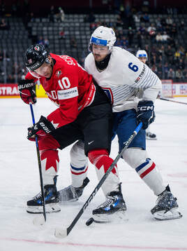 Brayden Schenn of Canada and Vincent Llorca of France