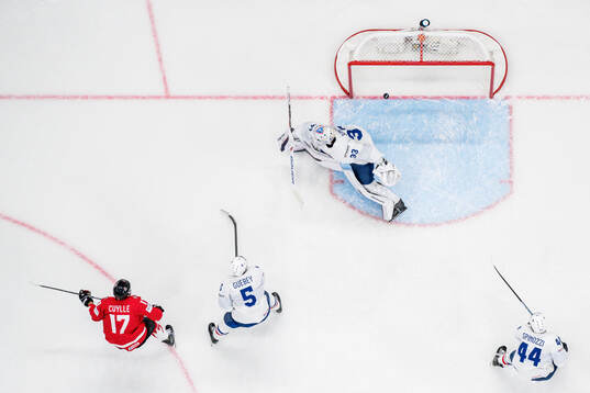 Enzo Guebey and goaltender Julian Junca of France defend