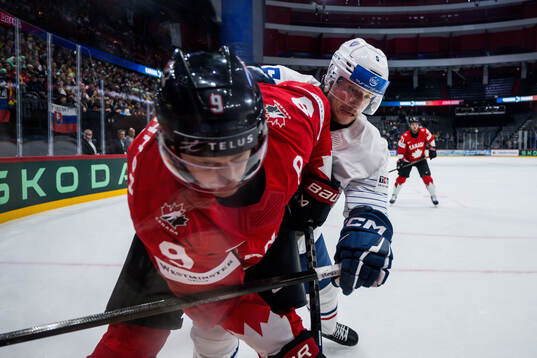 Nathan MacKinnon of Canada and Enzo Guebey of France