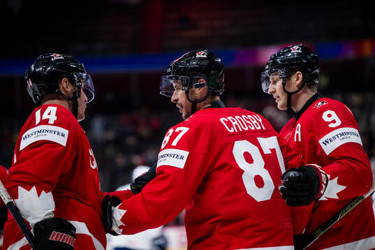Sidney Crosby of Canada celebrates with Bo Horvat and
