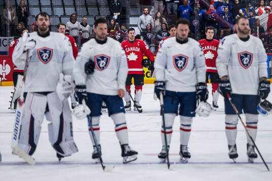 Sidney Crosby (middle) of Canada
