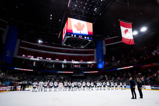 Players of Canada and of France as the flag of Canada is