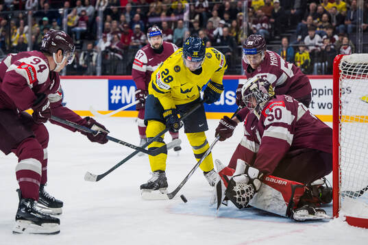 Elias Lindholm of Sweden agains Kristians Rubins and