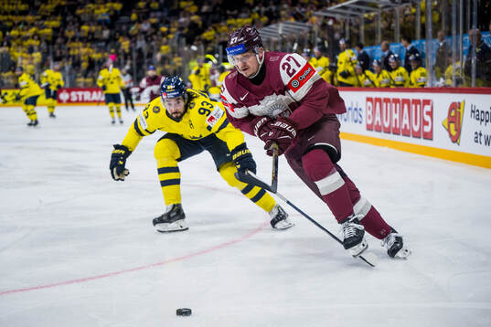 Mika Zibanejad of Sweden and Oskars Cibulskis of Latvia
