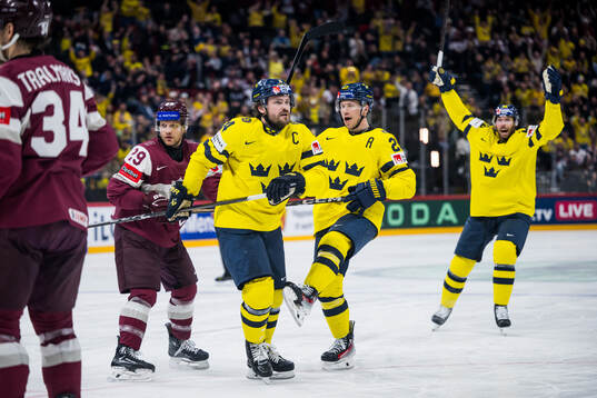 Rasmus Andersson and Lucas Raymond of Sweden celebrates