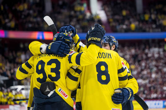 Mika Zibanejad and Jonas Brodin of Sweden celebrating the