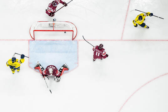 Filip Forsberg and Jonas Brodin of Sweden celebrate